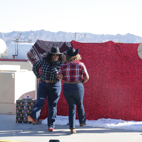 Two female teachers line dancing