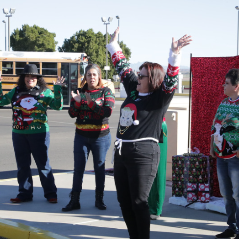 one teacher cheering outside