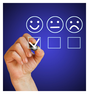 Hand filling out survey with sad face, moderate face, and happy face selected 